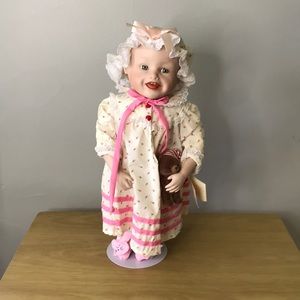 “Sarah” porcelain doll with stand